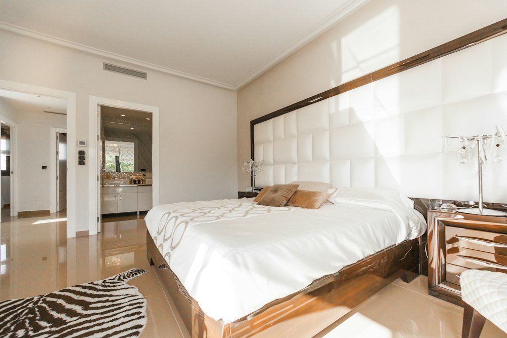 Restful bedroom representing relocation and investment clients