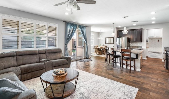 Open-concept family room and kitchen at 12570 Aviston Way, Rancho Cordova